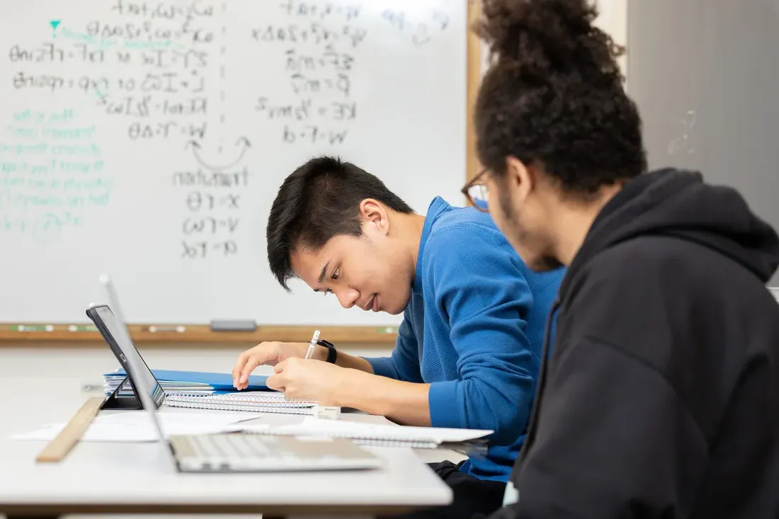 People sitting at desks.